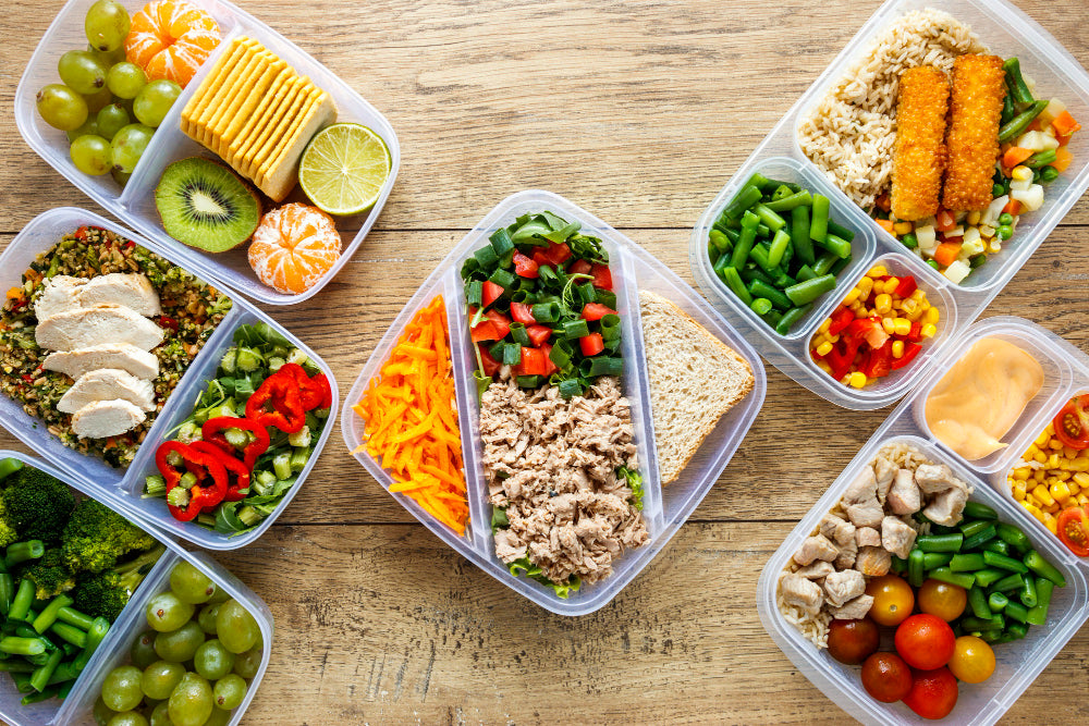 Anti-Inflammatory planning with healthy food containers on table.