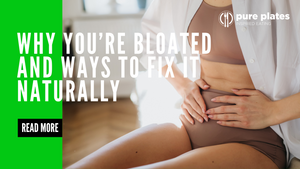 Woman sitting down, holding her stomach, showing signs of bloating and abdominal discomfort.